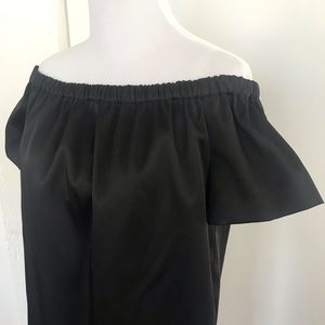 Maje’s off the shoulder satin mini dress.